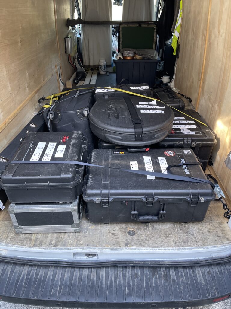 Full box truck of band tour supplies delivering to tour location